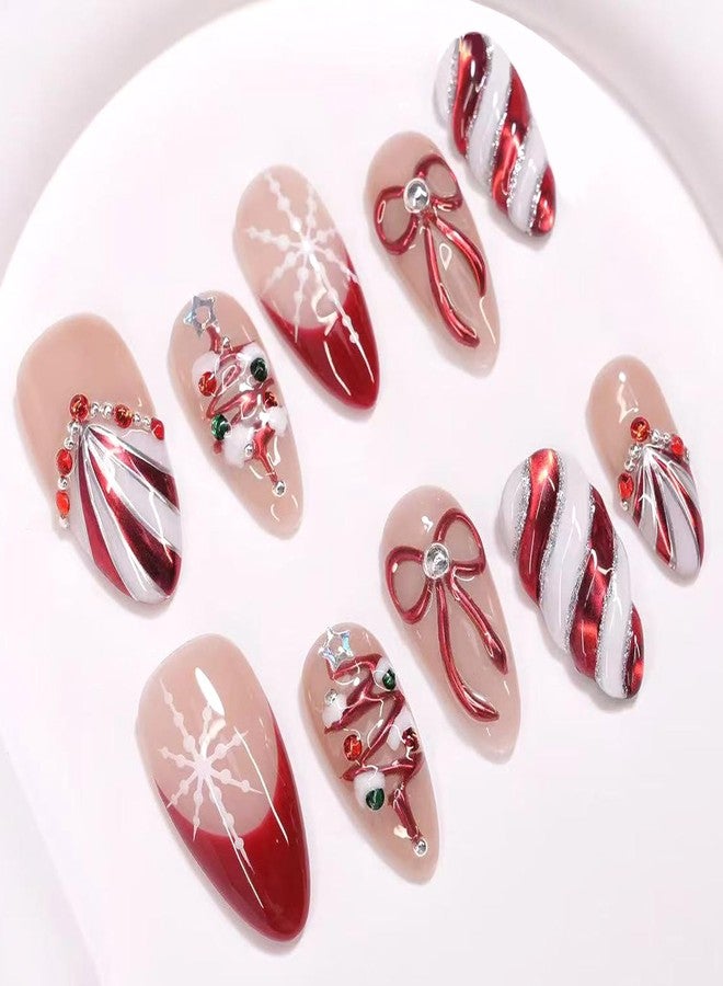 YKZFUI 30Pcs Handmade Christmas Press on Nails Medium Almond Fake Nails with 3D Rhinestones Jewelry Design Red French False Nails Cute Bow & Snow Full Cover Shiny Stripes Artificial Acrylic Nails for Women - Image 1